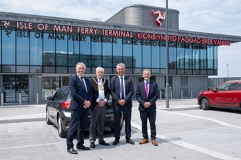 Picture of Minister Crookall with the Lord Mayor of Liverpool, Councillor Richard Kemp CBE, and representatives from Peel Waters, standing in front of the new sea terminal in Liverpool